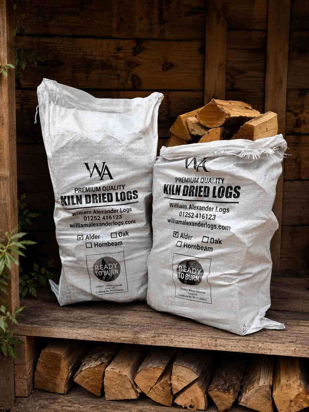 Easy Bags of kiln-dried logs stacked and ready for pallet delivery